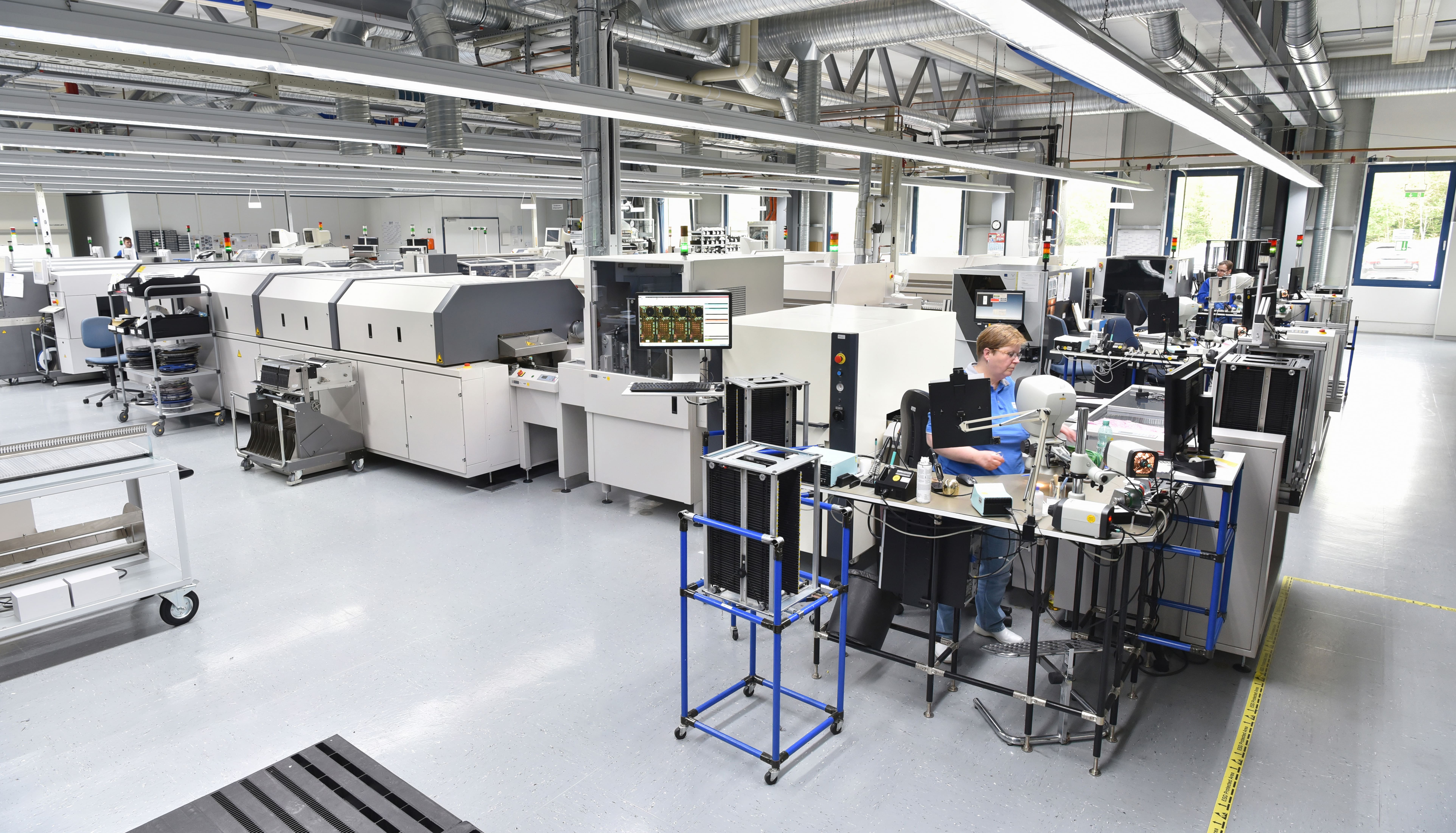 Electronics manufacturing equipment on a production line.